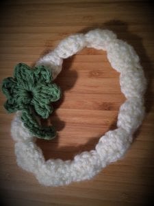 Green four leaf clover added to crochet head band.