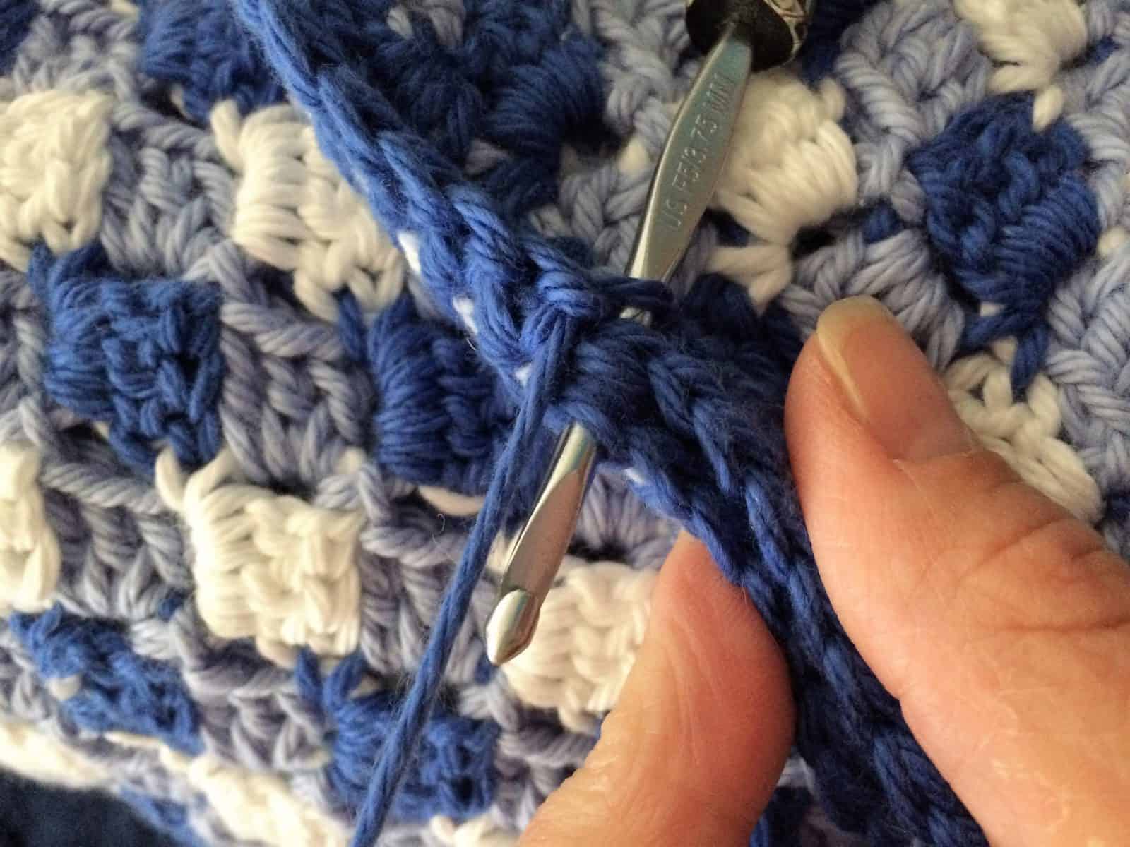 Join both squares with single crochet stitch through both layers.
