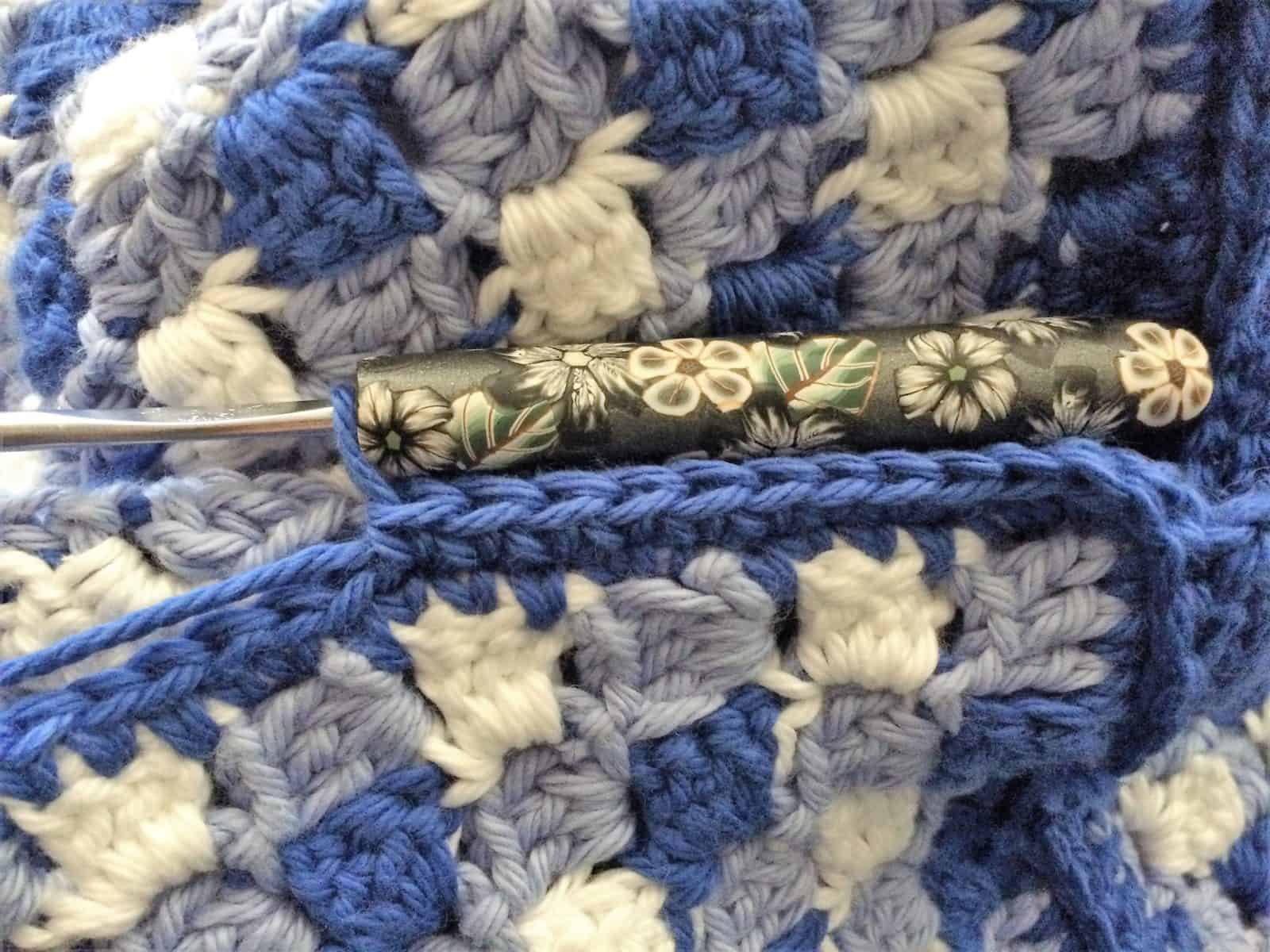 Join edge on gingham crochet pillow.