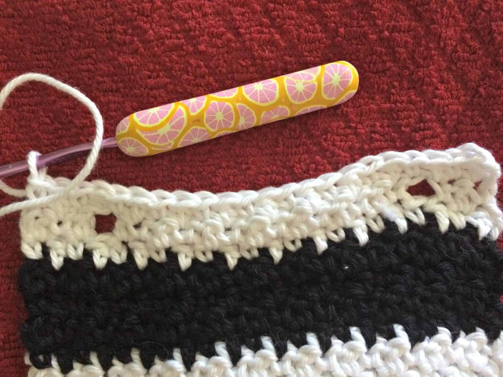 Row after buttonholes crochet towel topper.