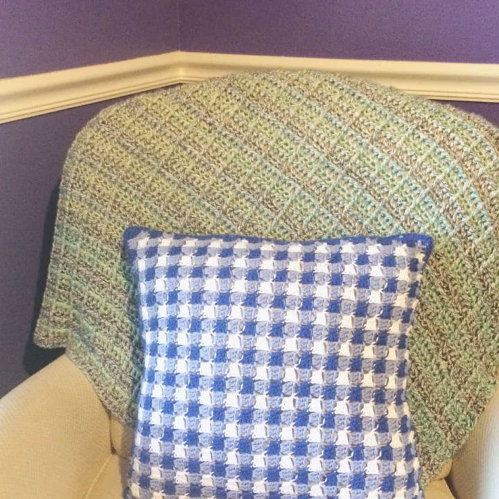 Gingham pillow crochet pattern on chair.