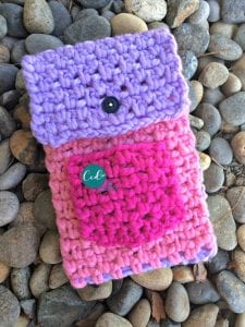 picture of pink crochet tablet cover buttoned closed