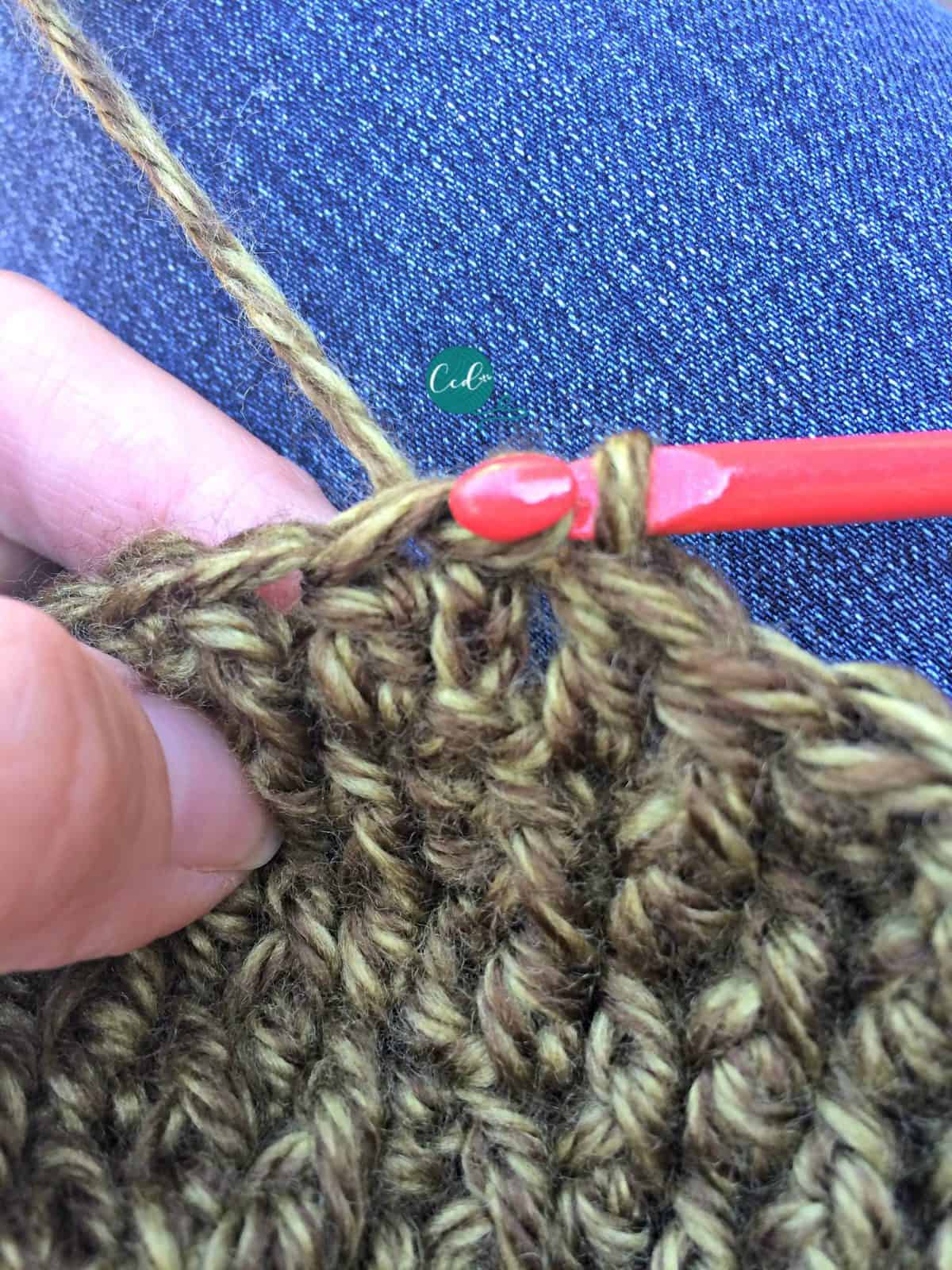 Slip stitch to join round of textured slouchy hat.