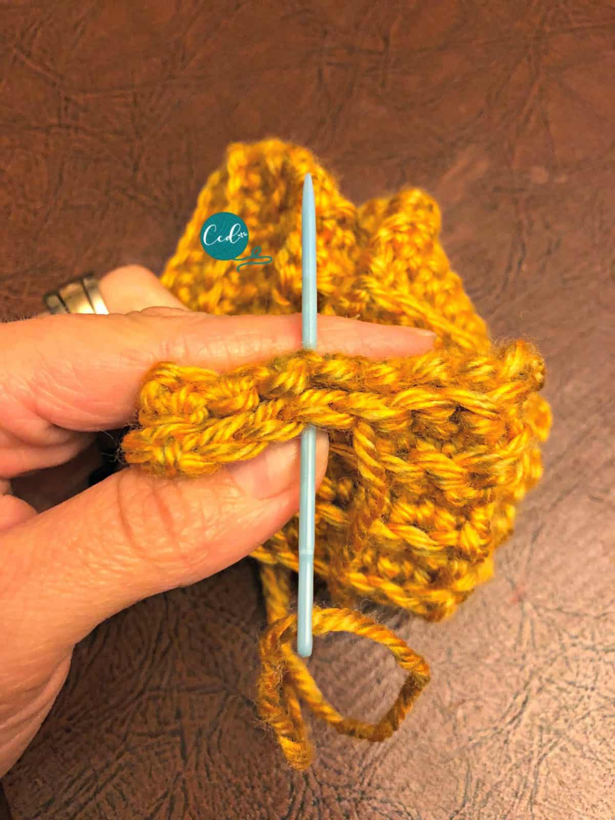 Use yarn needle to sew.