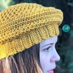 Woman in yellow crochet beret.