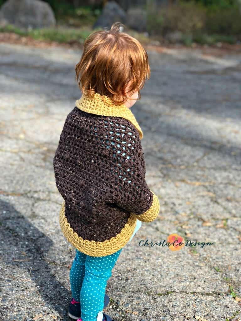 picture of toddler in cocoon shrug