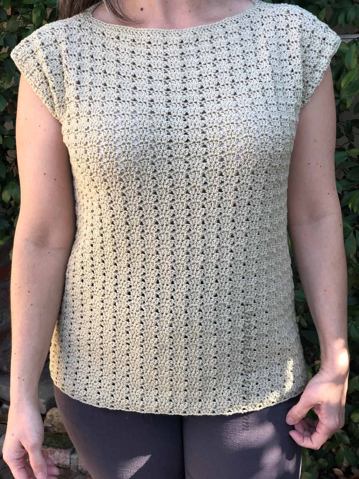 Close up of stitch pattern on women's crochet summer top.