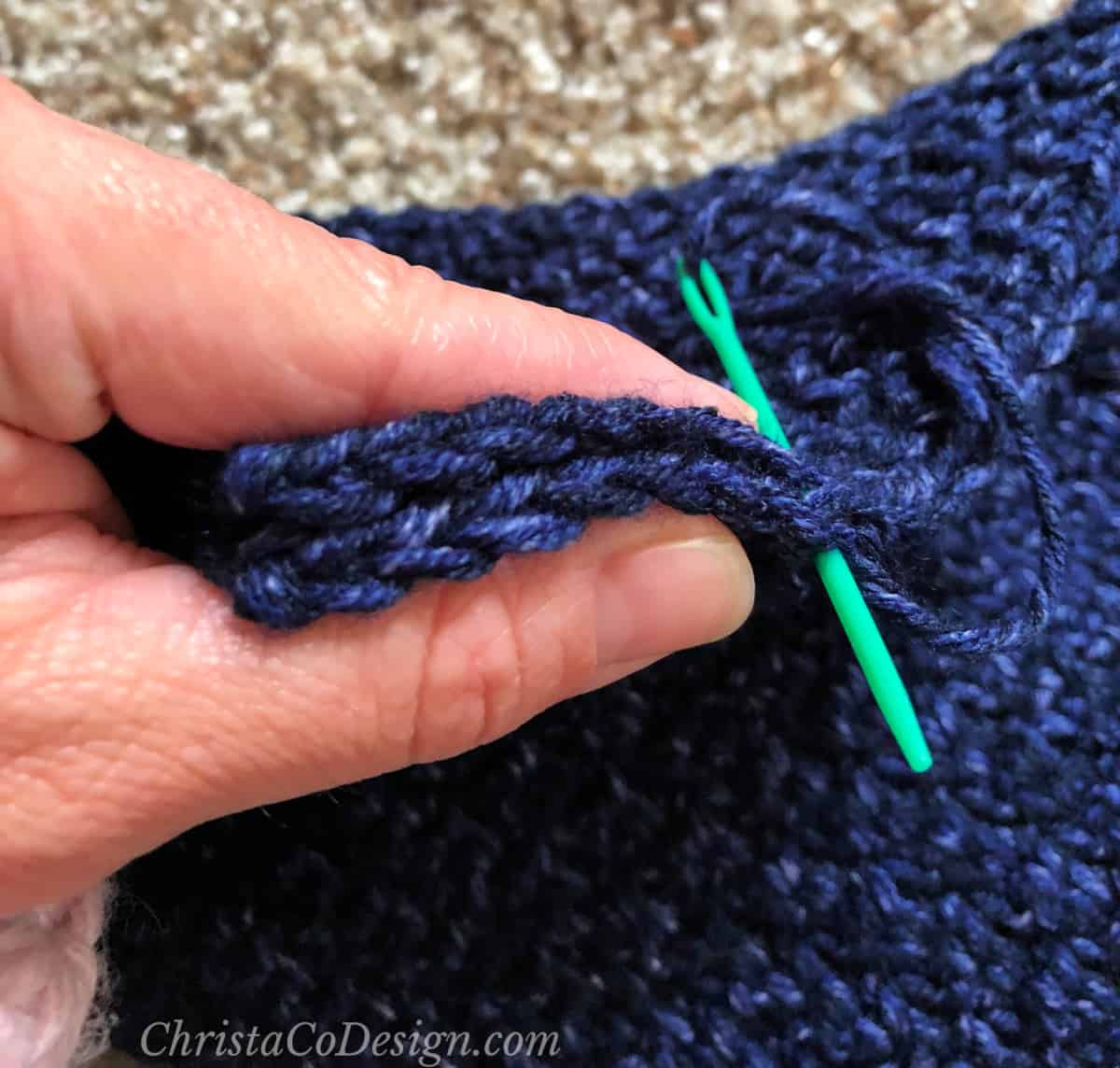 Sew stitch for stitch with green yarn needle.