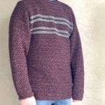 Burgundy and grey striped sweater on man.