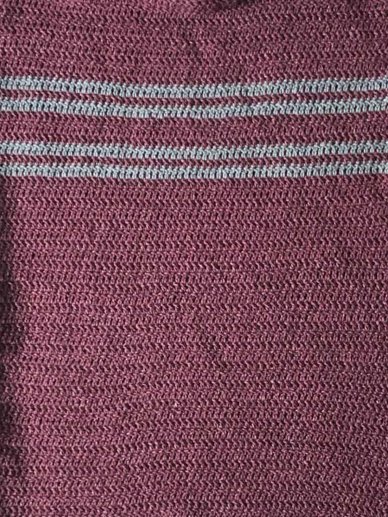 picture of grey stripes on maroon sweater panel