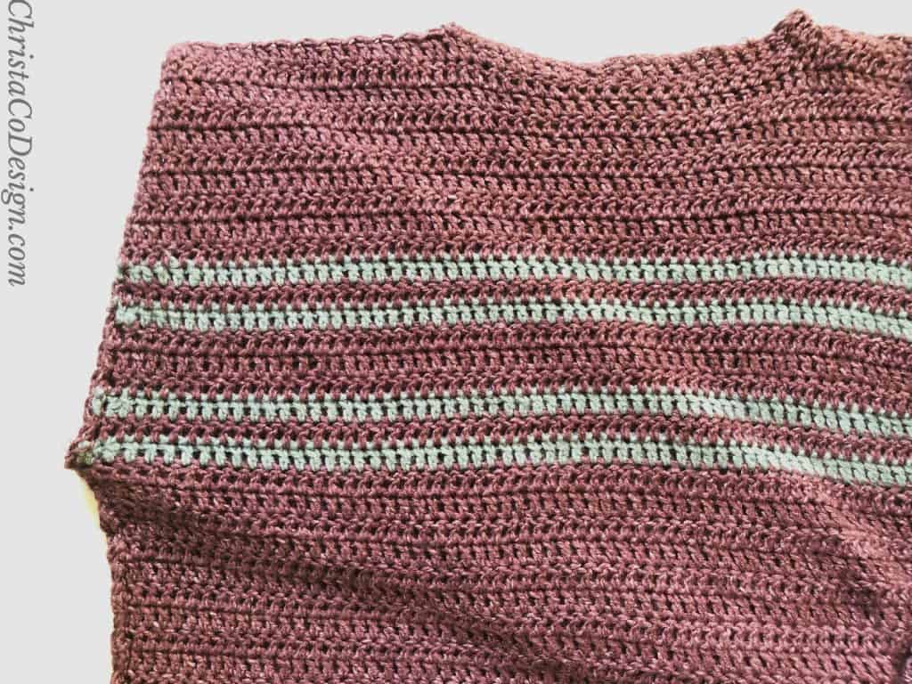 picture of maroon crochet sweater with sleeve inside for seaming