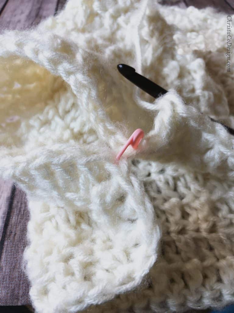 picture of crocheting around body and skipping sleeve stitches