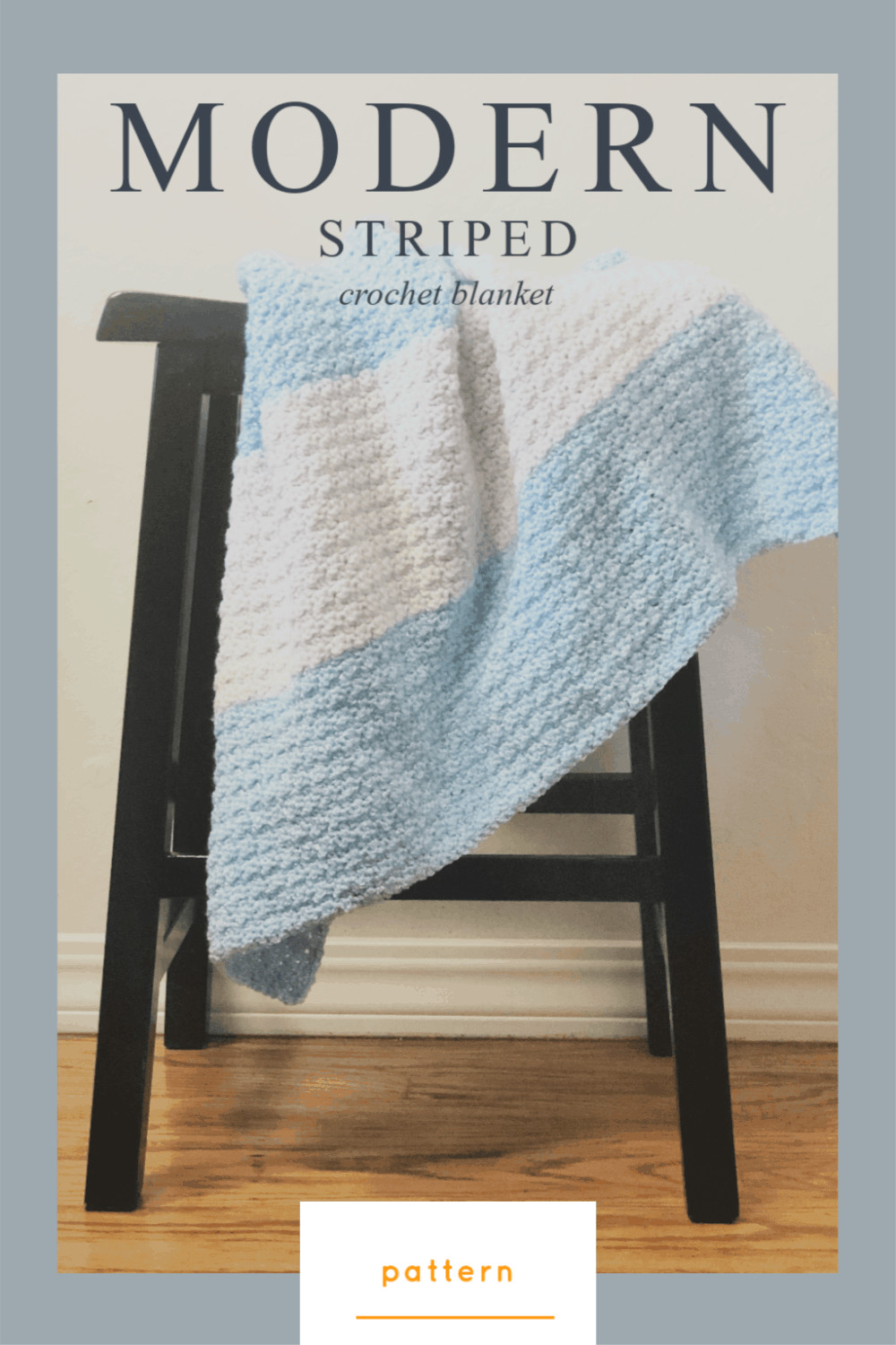 picture of blue and white crochet striped blanket on black stool