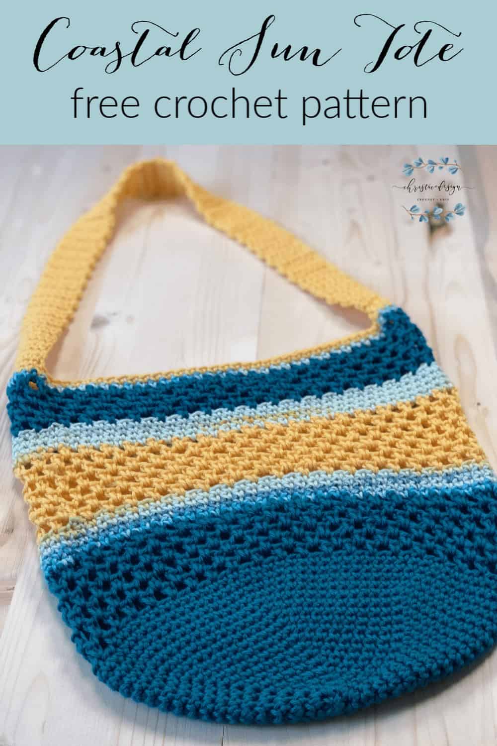Pin image and text for free crochet tote bag in blue and yellow laid flat on wood table.
