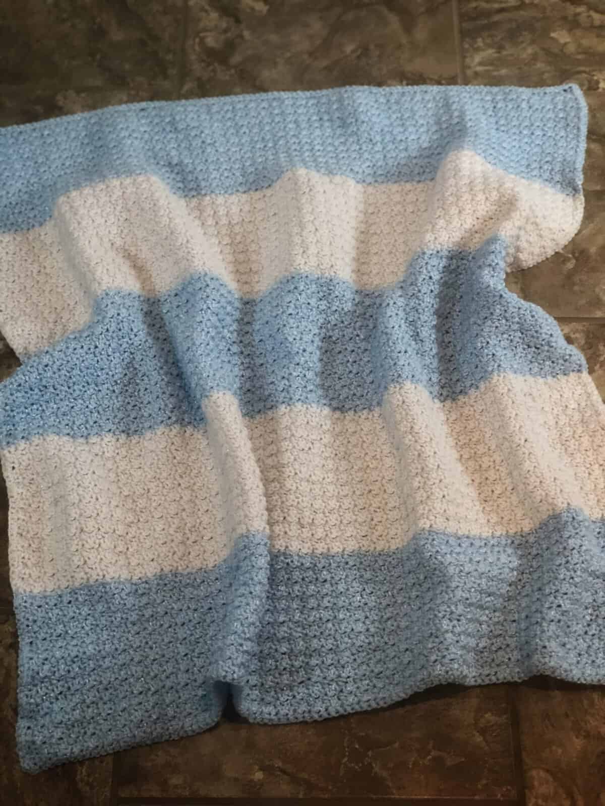 Blue and white striped crochet blanket.