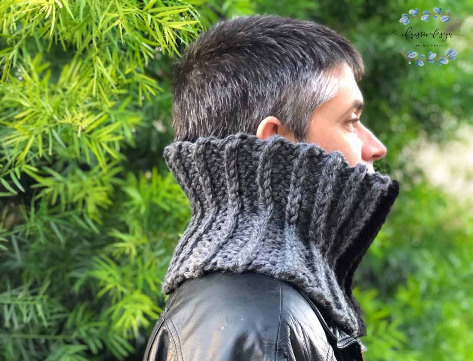 Man looking away with chunky ribbed cowl in grey.