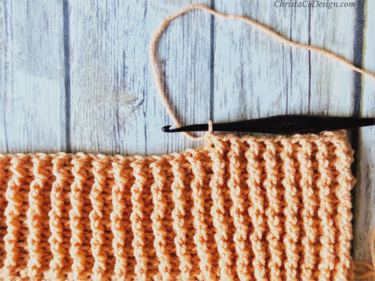 picture of crochet blanket in orange border