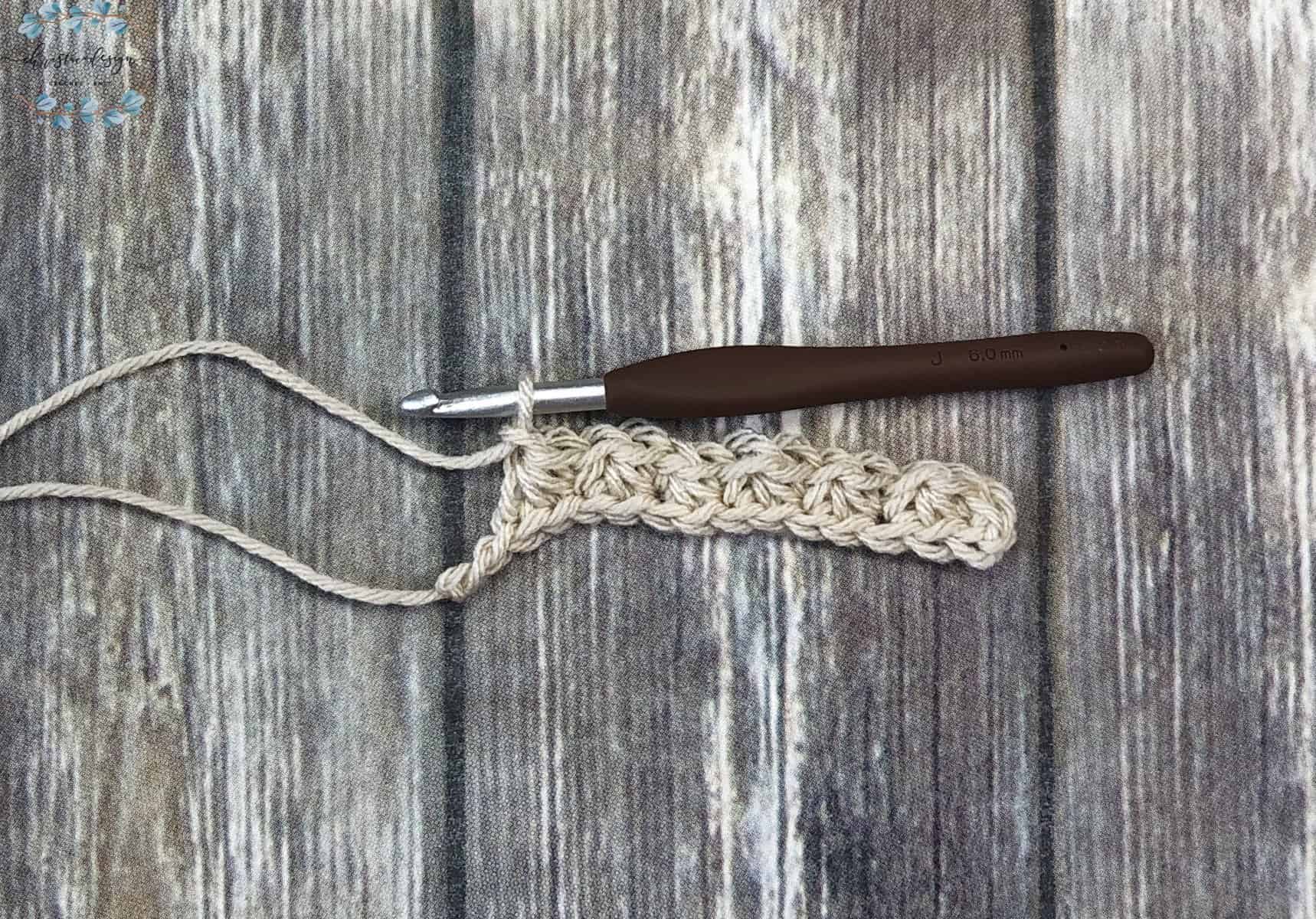 picture of trinity stitches across the row in beige yarn