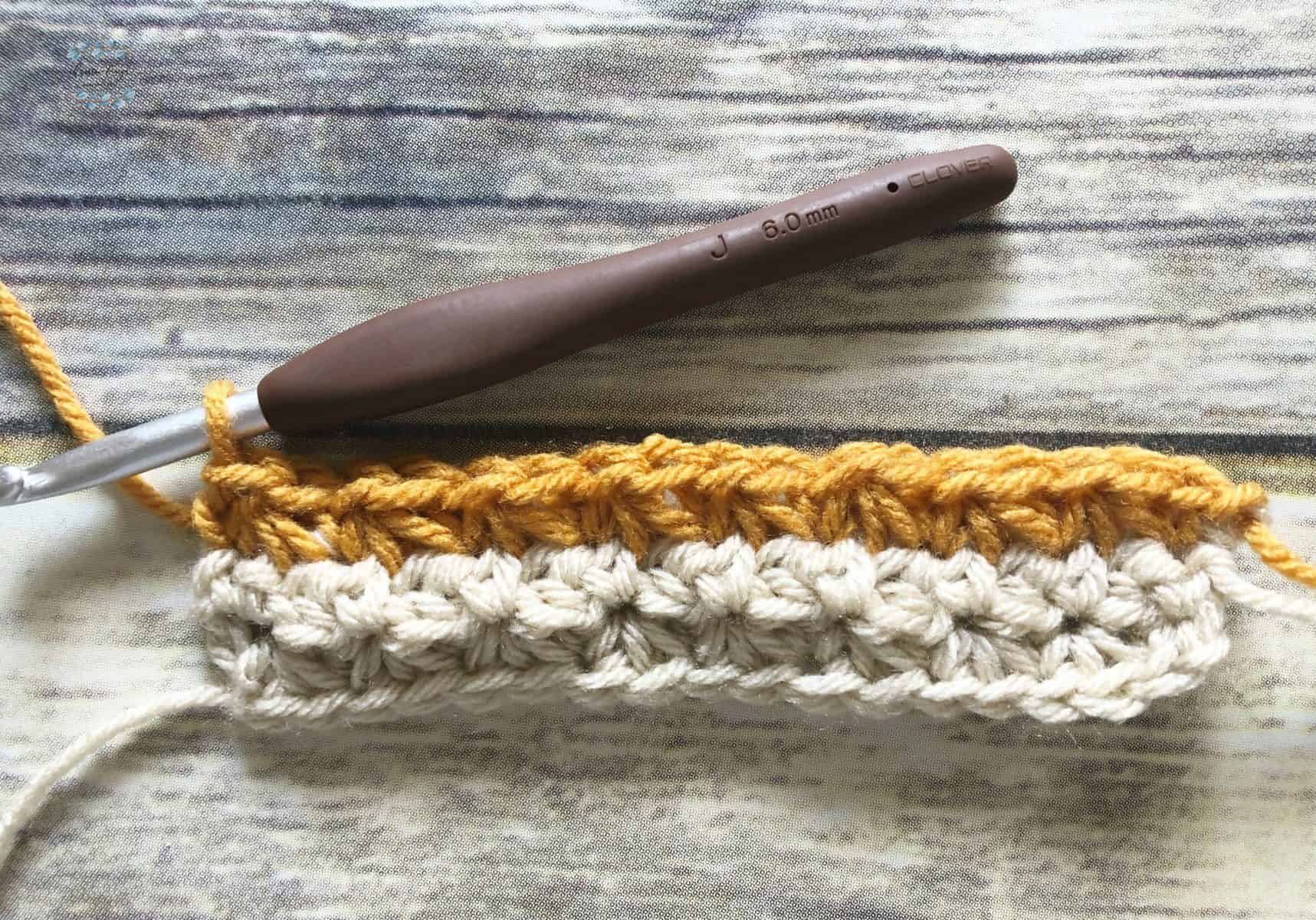 Beige and gold color change trinity stitch crochet tutorial.