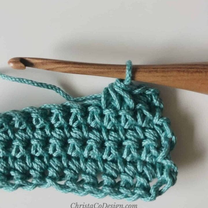 Single crochet 3 together in teal yarn on hook.