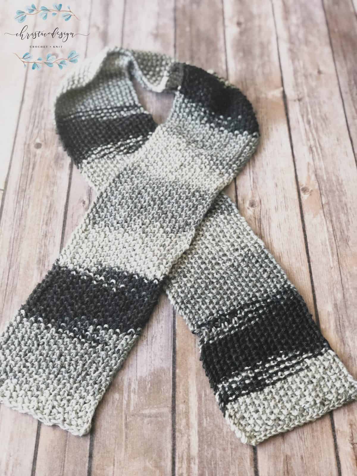 picture of skinny grey textured knit scarf crossed flat