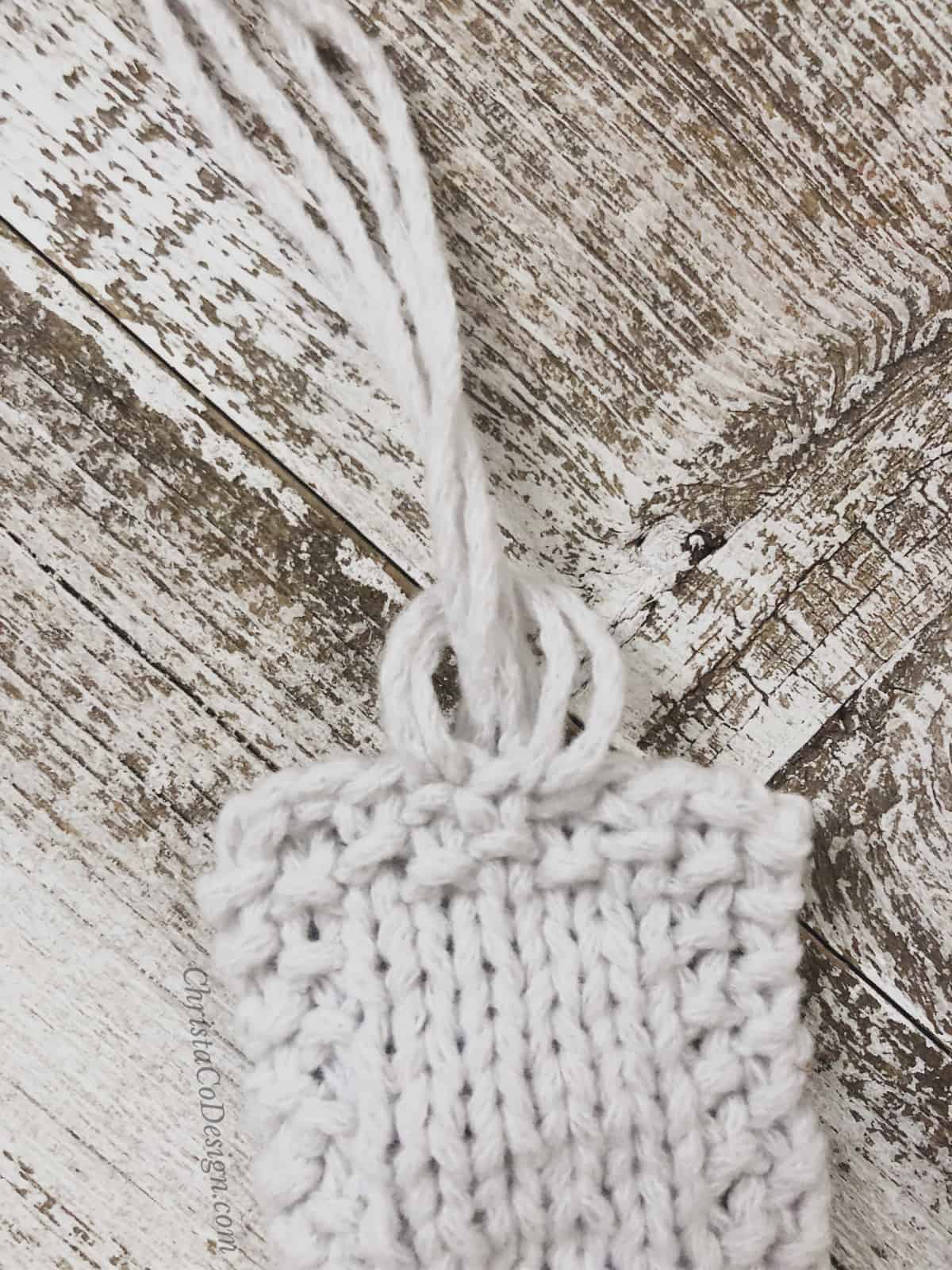 picture of fringe looped through on knit bookmark