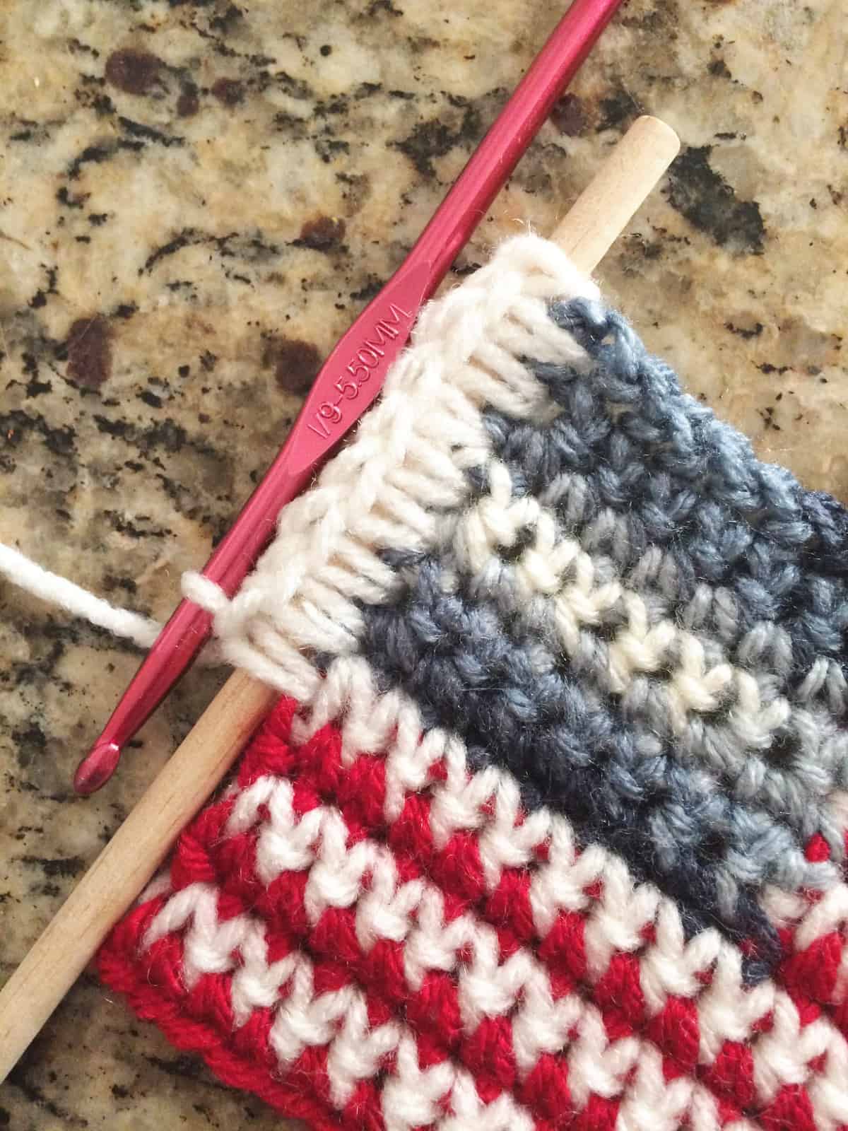 Single crochets down dowel to attach crochet flag.