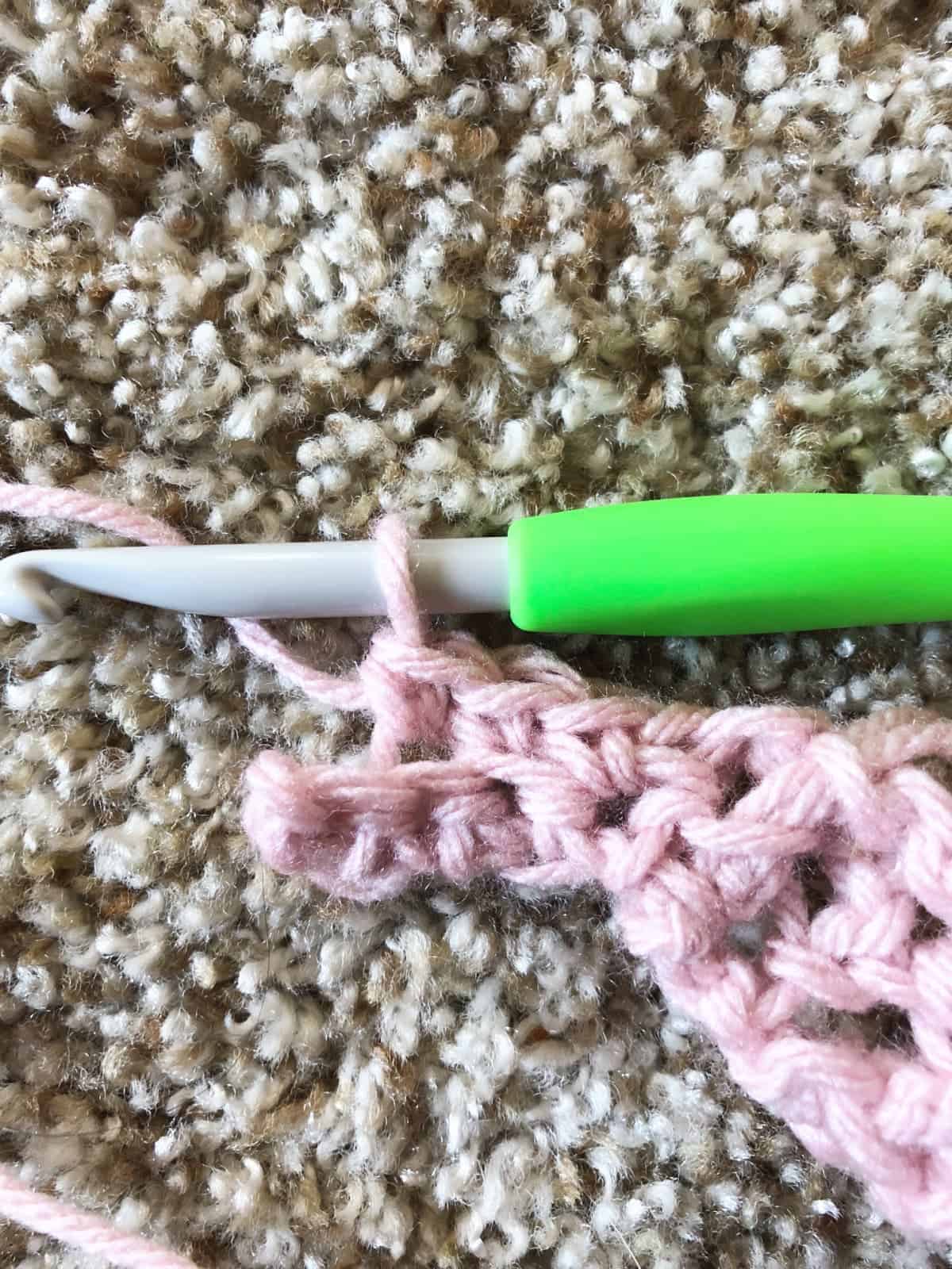 Row 2 of single crochet ribbing.