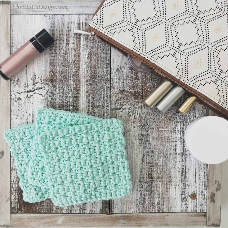 3 mint green square crochet face scrubbies and make up bag.
