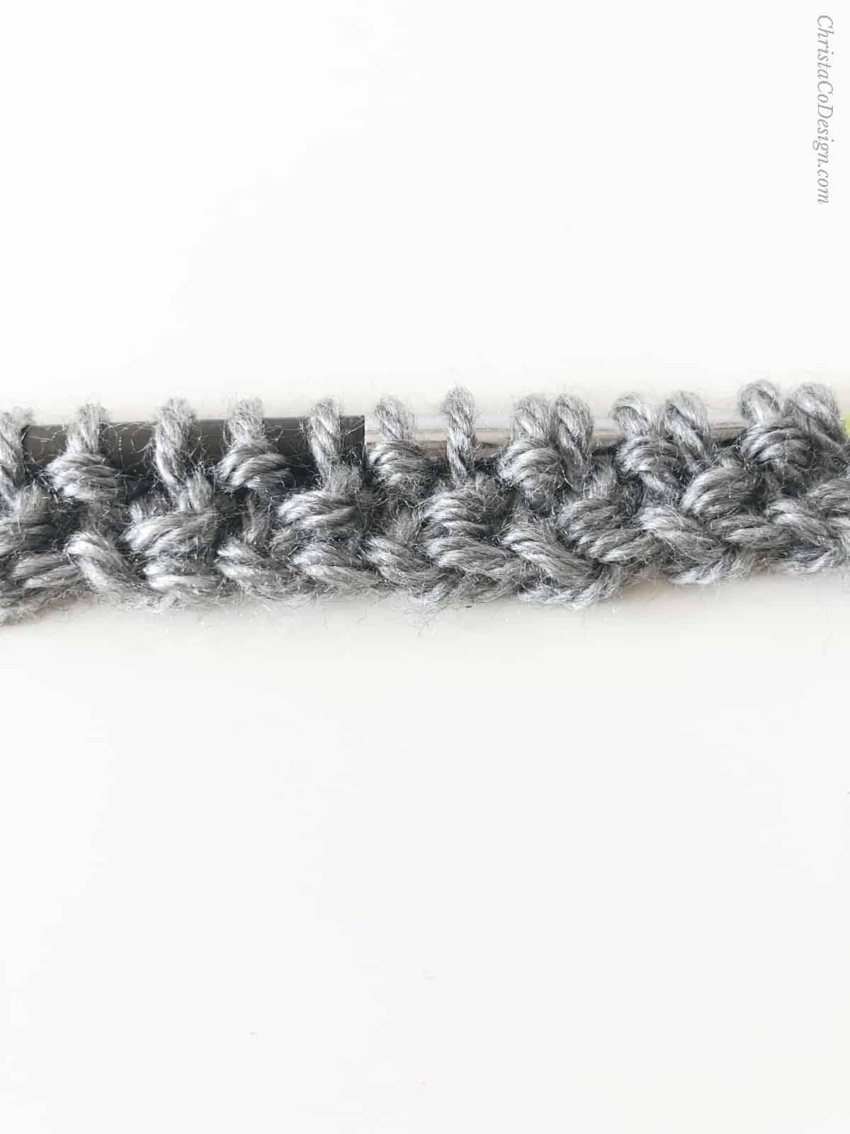A few rows of seed stitch in grey.