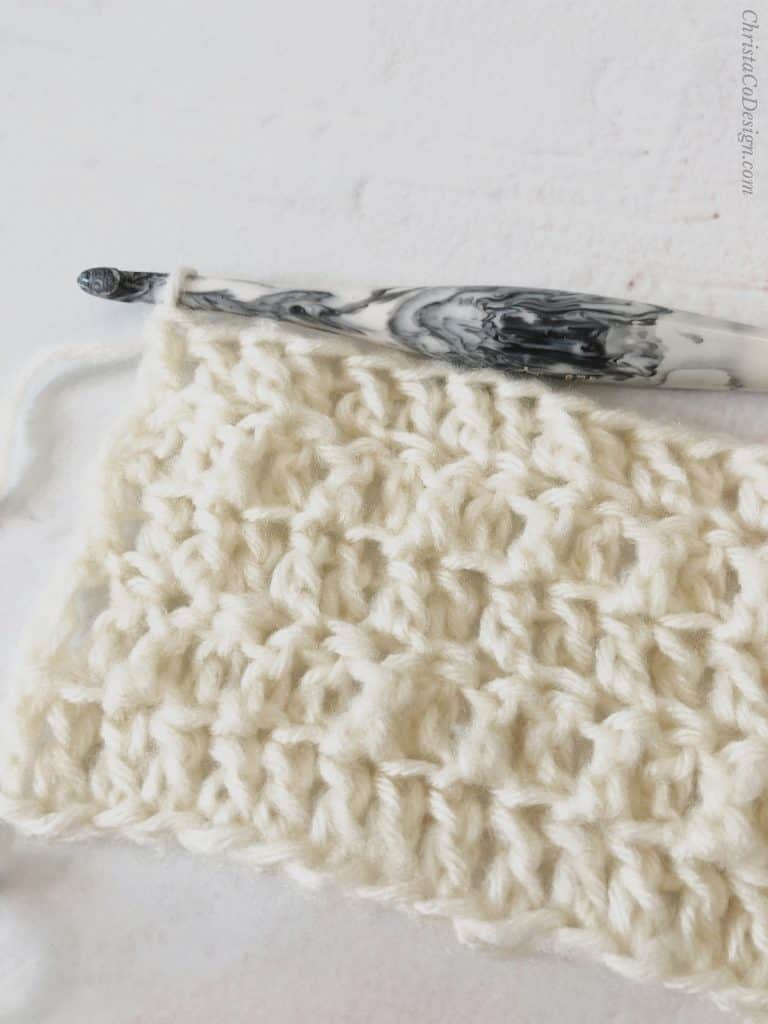 Front loop double crochet and blo dc crochet stitches alternated in white.