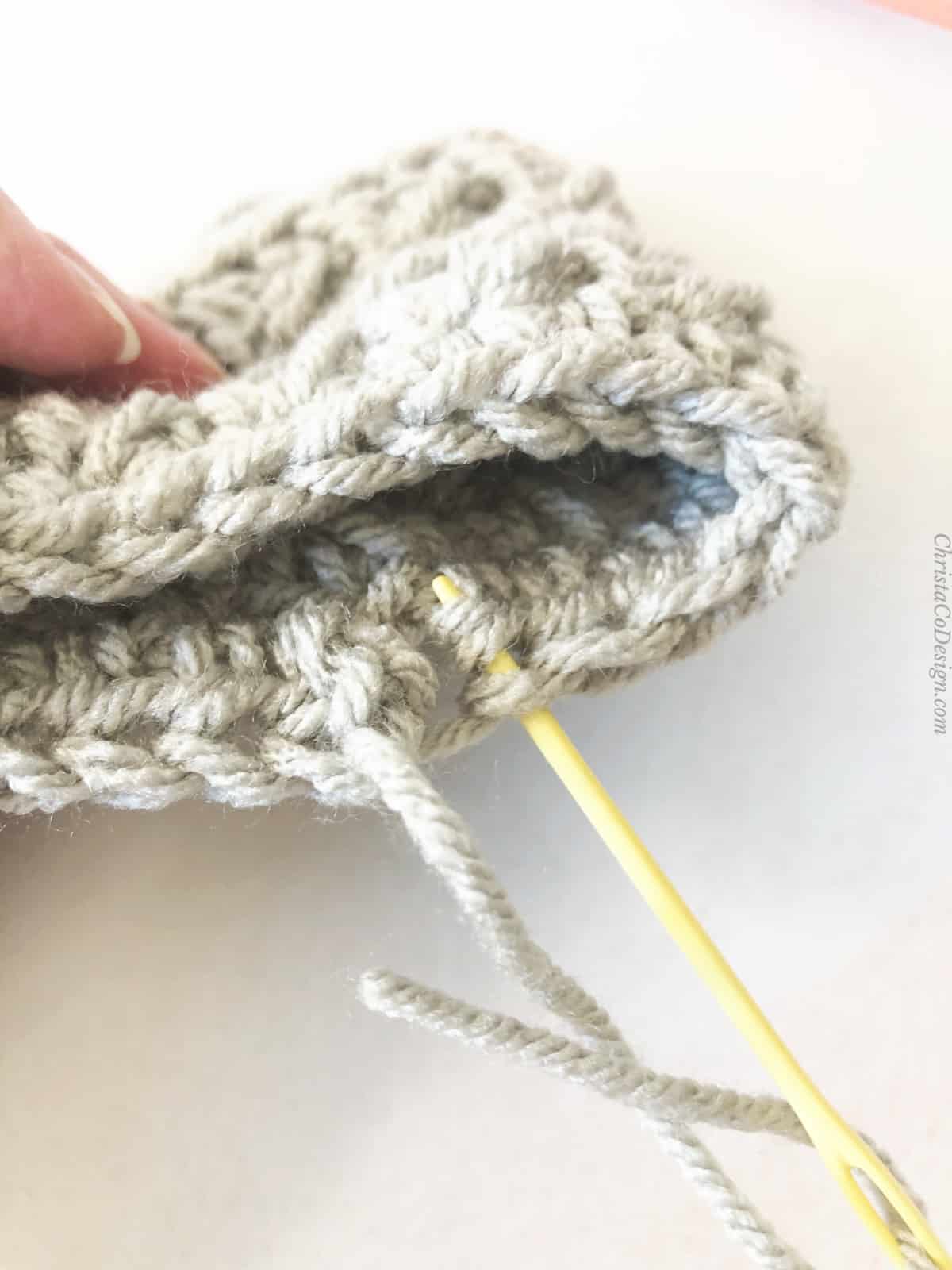 picture of needle going down into stitch