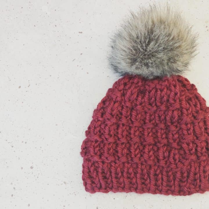 Maroon chunky knit hat pattern with Pom Pom.