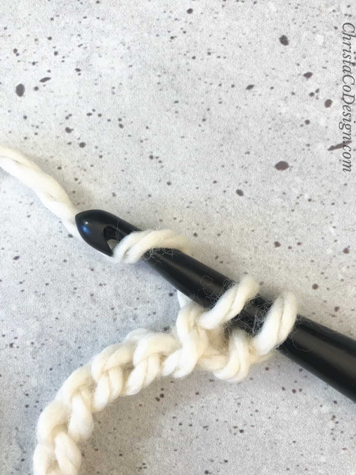 picture of yarn over the hook for sc crochet