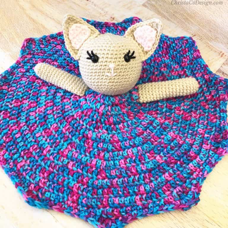 Crochet kitty lovey with purple dress.