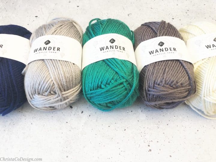 Furls Wander acrylic yarn in blue, grey, teal, grey and white.