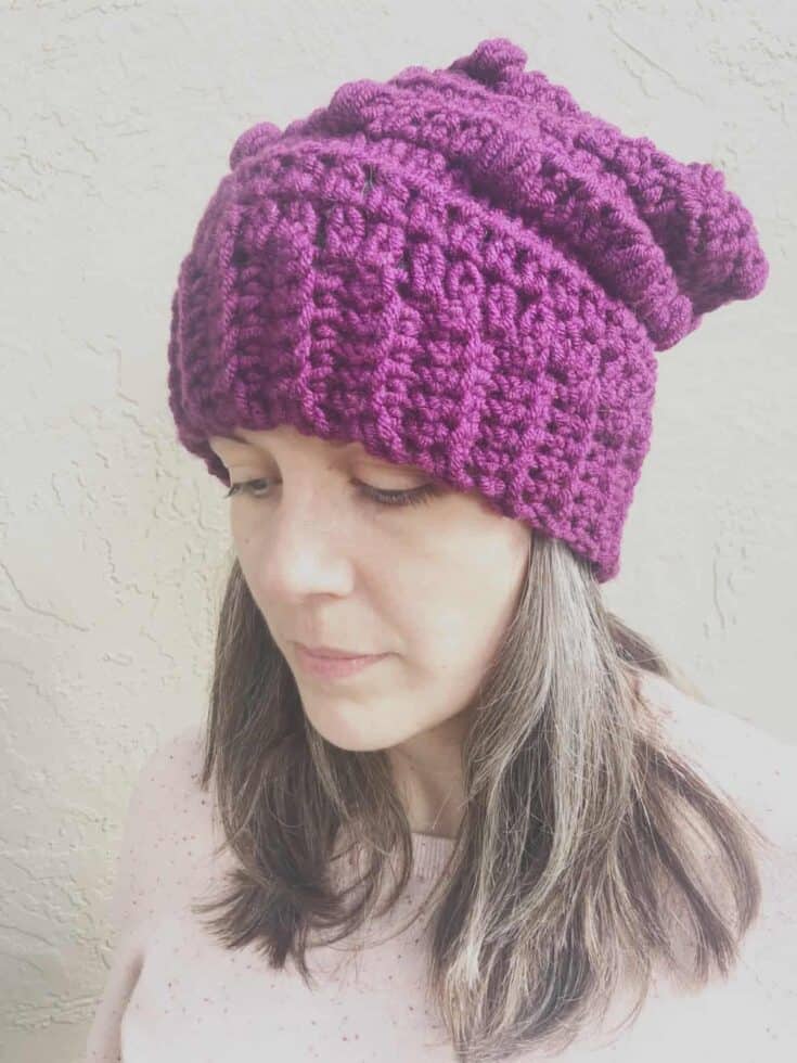 Woman in purple slouchy hat.