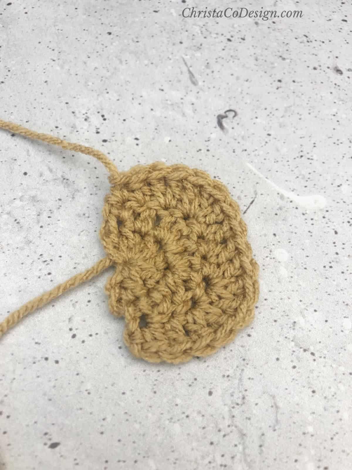 Third round of crochet ear for bear hat.