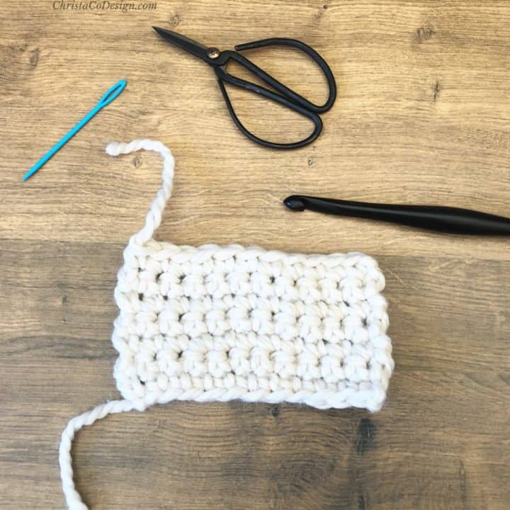 Swatch, scissors, yarn needle and crochet hook.