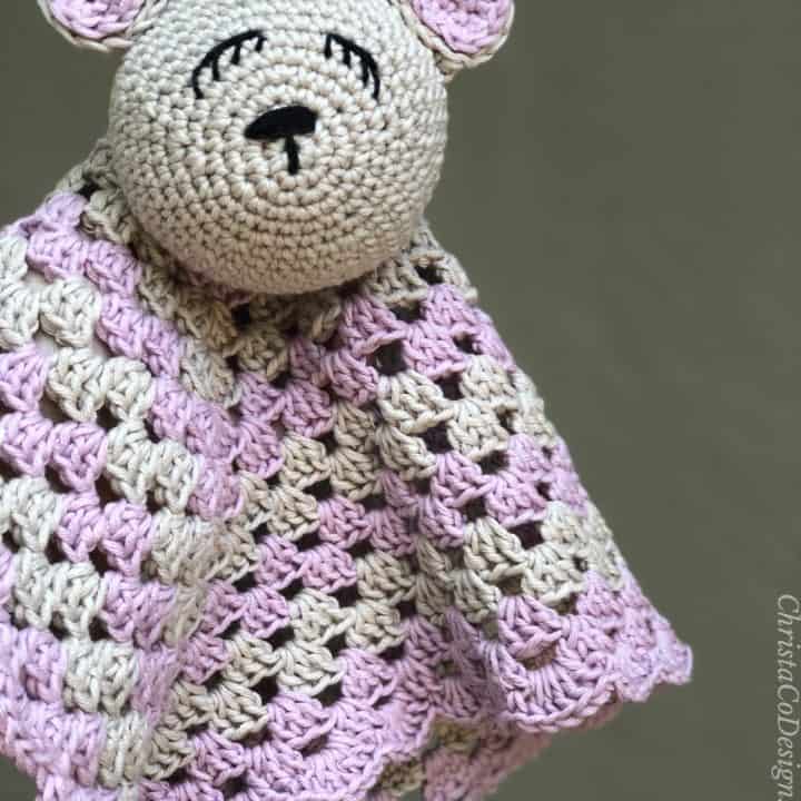 Crochet bear lovey in pink and beige.