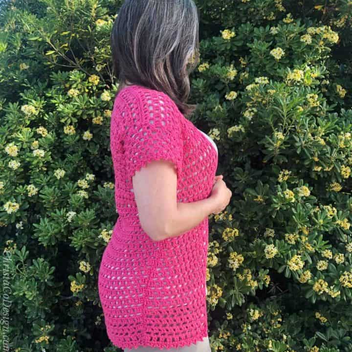 Side view of pink lacy summer cardigan crochet pattern.