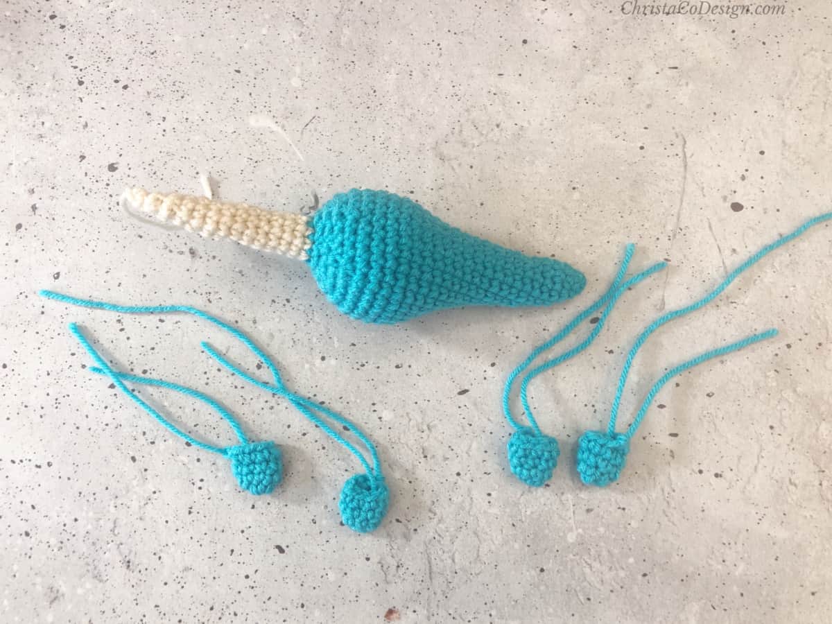 Narwhal body and tusk with crochet fins ready for attaching.