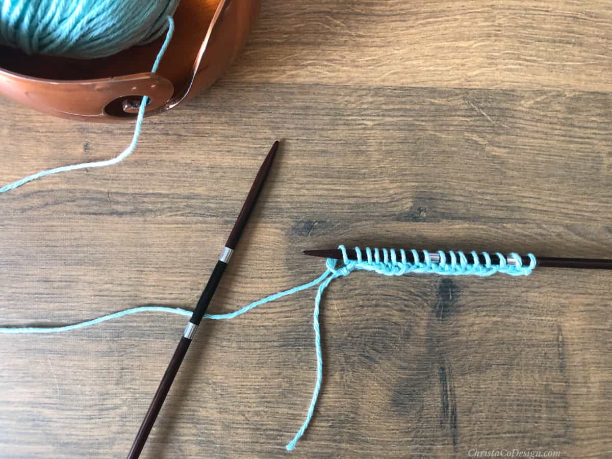 Row of knit stitches on needle.