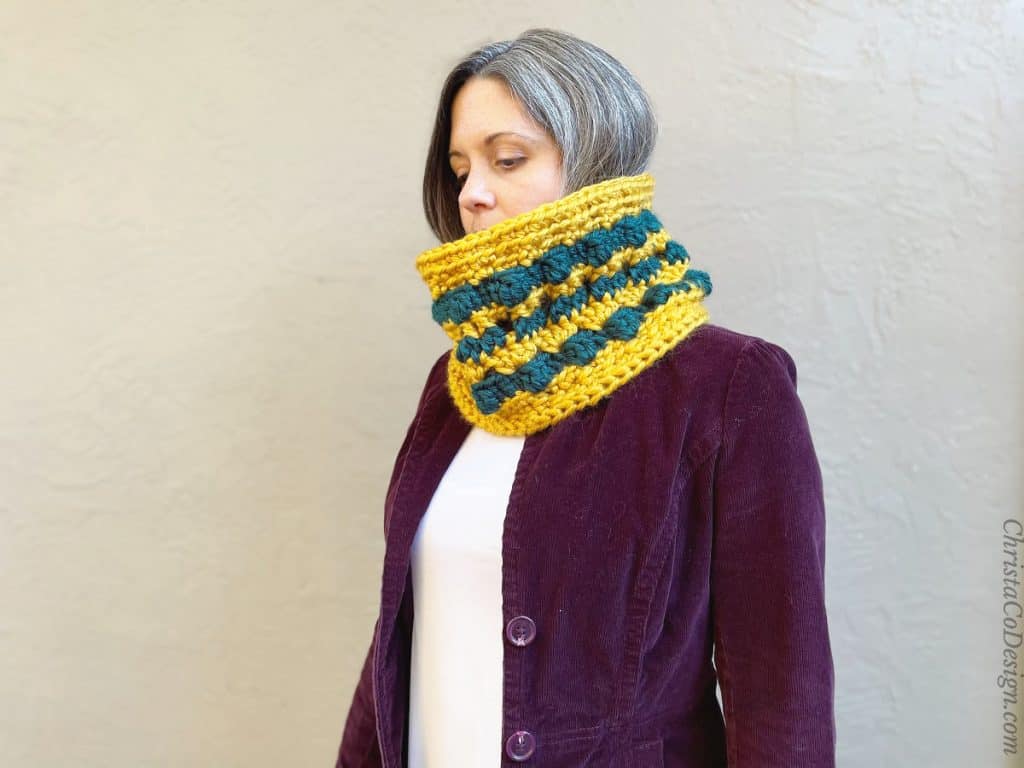 Chunky crochet cowl pattern with stripes and color.