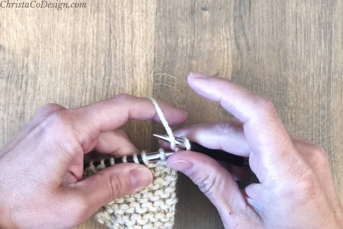 Wrap yarn over right needle from front to back.