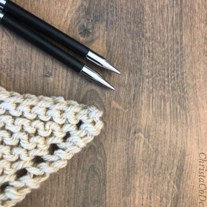 Triangle of knitting with yarn over increases on edge.