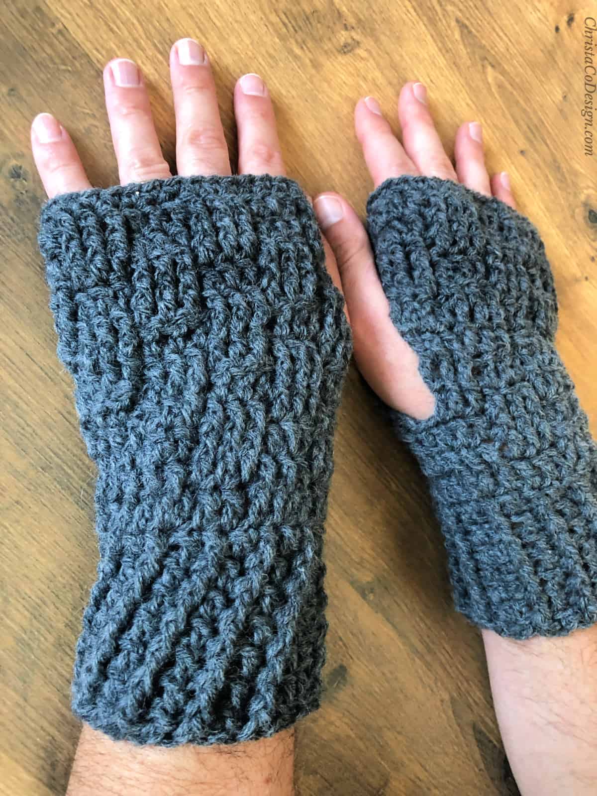 Men's grey crochet wrist warmers.