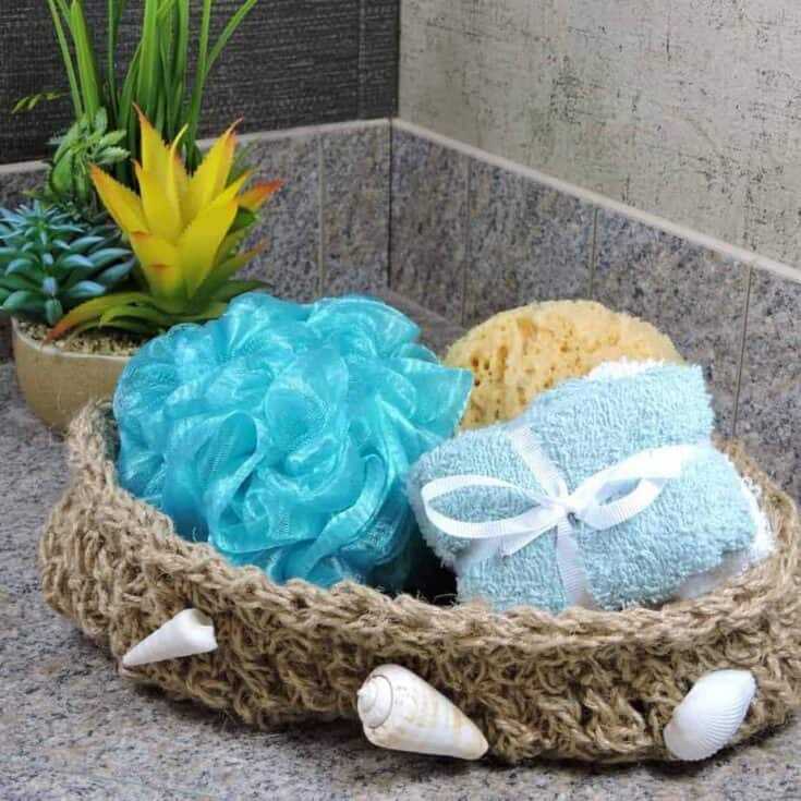 Oval crochet basket in twine with toiletries.