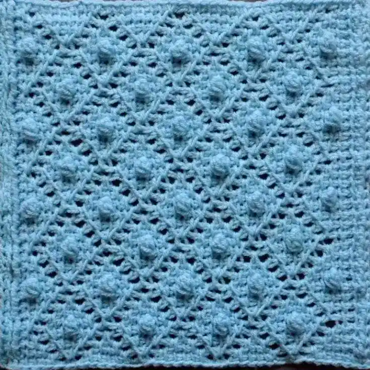 Blue crochet lace square.