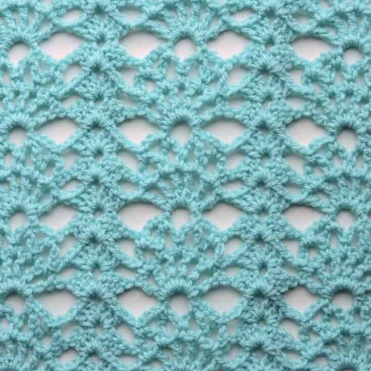 Blue crochet lace swatch.